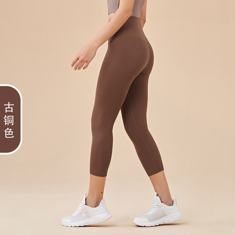 Ladies' New High-waisted Cropped Trousers Yoga Pants with No Embarrassment, Back Pocket Peach Hip-lifting Exercise Pants.